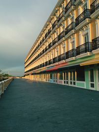 Building by sea against sky in city