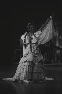 Portrait of woman standing on stage