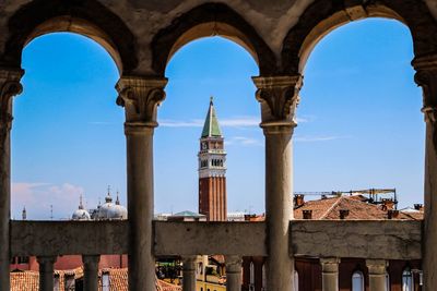 Church seen through arch against sky
