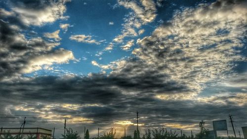 Low angle view of dramatic sky during sunset