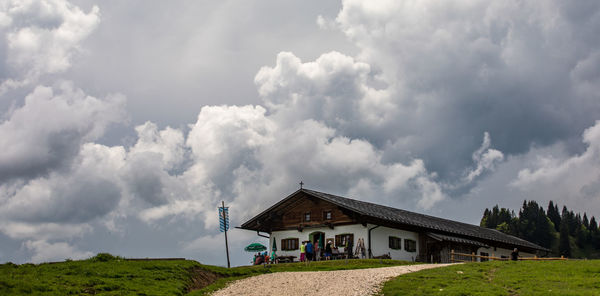 House on field against sky