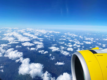 Aerial view of aircraft wing against sky