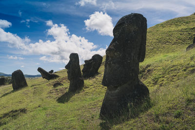 Moai statues against sky