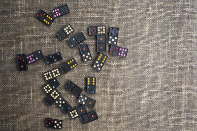 Directly above shot of dominoes on textile