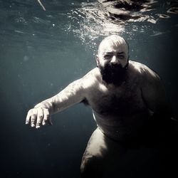 High angle view of man swimming in pool