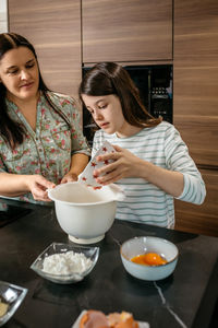 Portrait of young woman having breakfast