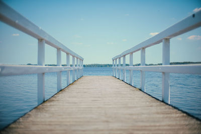 Pier over sea against sky