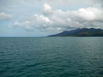 Scenic view of sea against cloudy sky