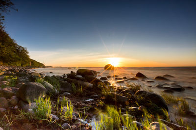 Scenic view of sea against sky during sunset