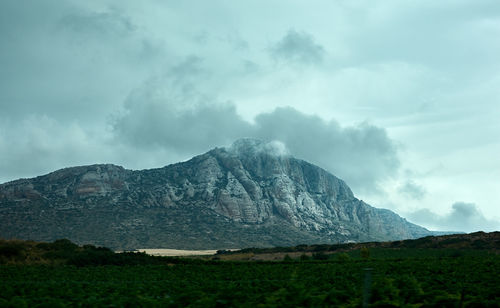 Mountain with clouds on top. landscape just before the rain