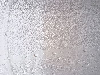 Full frame shot of raindrops on glass