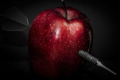 Close-up of strawberry over black background