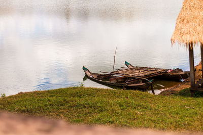 Fishing boat moored at lakeshore