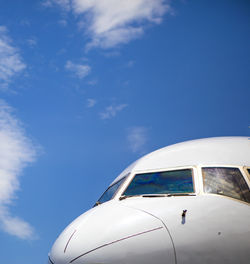 Cockpit of jet airplane against blue skies