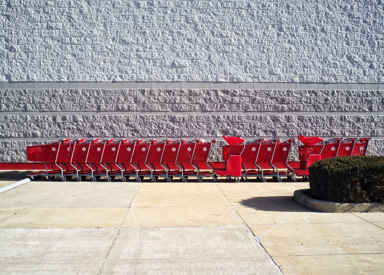 HIGH ANGLE VIEW OF RED CHAIRS AGAINST WALL