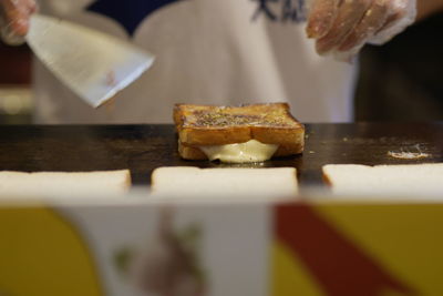 Close-up of preparing food on table