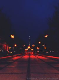 Illuminated street at night