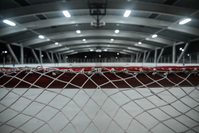 Close-up of hockey net at night