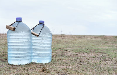 Two large plastic transparent carboys, capacity 5 gallons, for water coolers with drinking water 