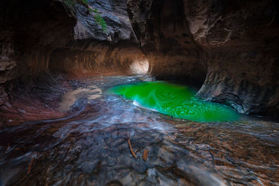 Hot spring by rock formations