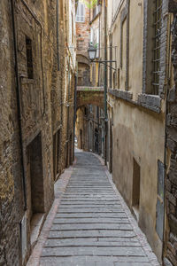 Narrow alley amidst buildings