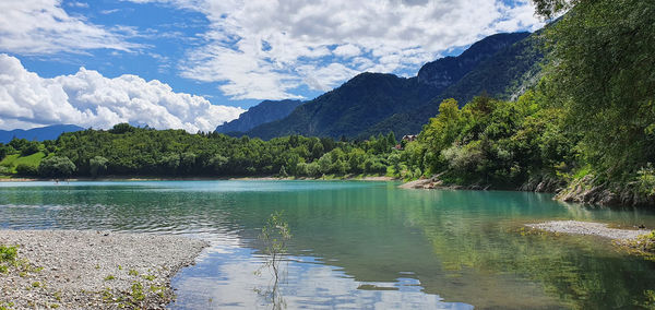 Scenic view of lake and mountains against sky