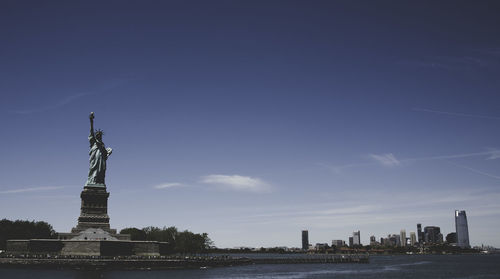 Statue of liberty against blue sky