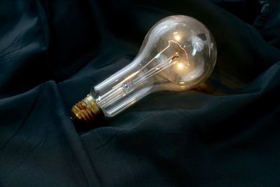 Close-up of illuminated light bulb