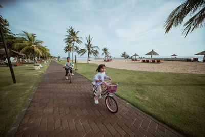 People riding bicycle on field