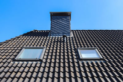 Low angle view of building against blue sky