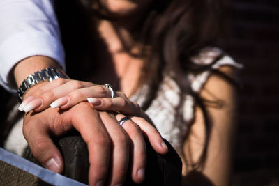 Close-up of couple holding hands