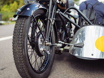 Close-up of motorcycle on street