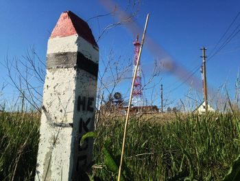 View of field against blue sky