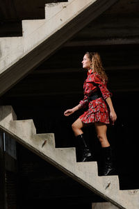 Low angle view of woman on staircase