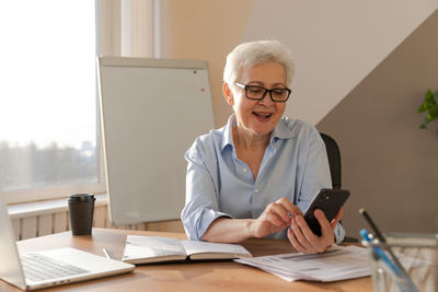 Female doctor working at table