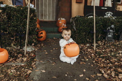 Adorable toddler boy dressed up as mummy on halloween trick-or-treat