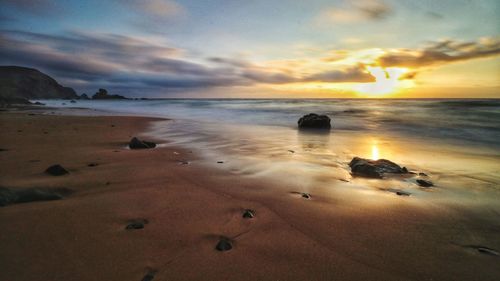 Scenic view of sea against sky during sunset