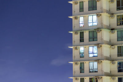 Low angle view of building against blue sky