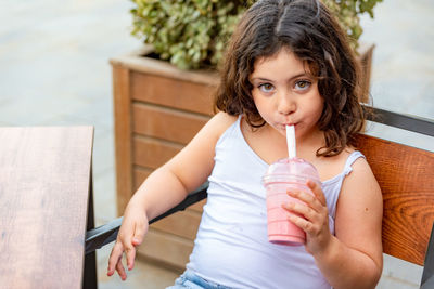 Portrait of a girl drinking glass