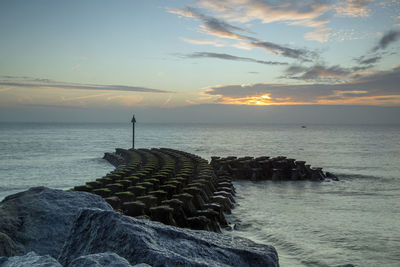 Scenic view of sea against sky during sunset