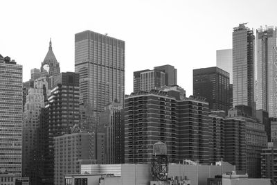 Skyscrapers in city against clear sky