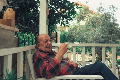 Portrait of senior man drinking coffee. elderly man sitting with cup of coffee in his hand.