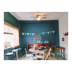 Empty chairs and table against wall at home