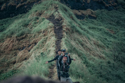 Man standing on mountain road