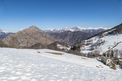 Wide view of the mount grigna with snow and blue sky