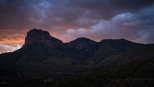 Scenic view of mountains against sky at sunset