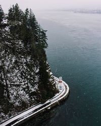 High angle view of road by sea against sky