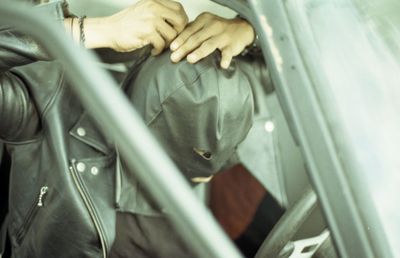 Close-up of man wearing mask in car