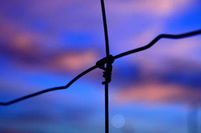 Close-up of chain against cloudy sky