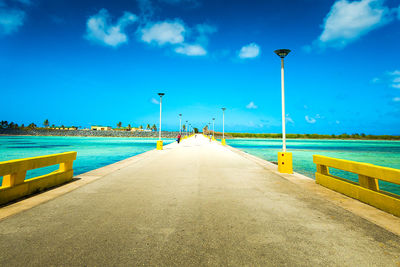 Jetty leading to calm blue sea